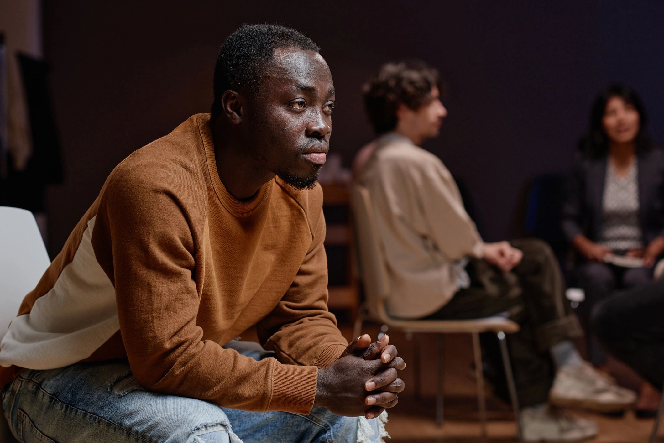 Member listening thoughtfully in a group setting