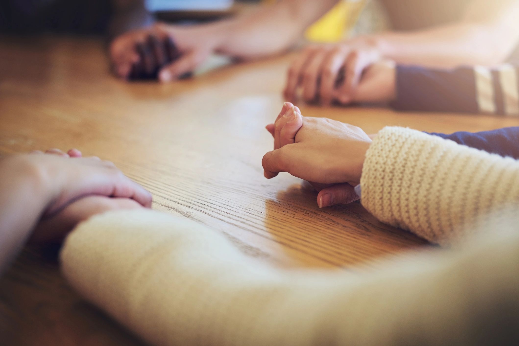 Group joining hands in solidarity