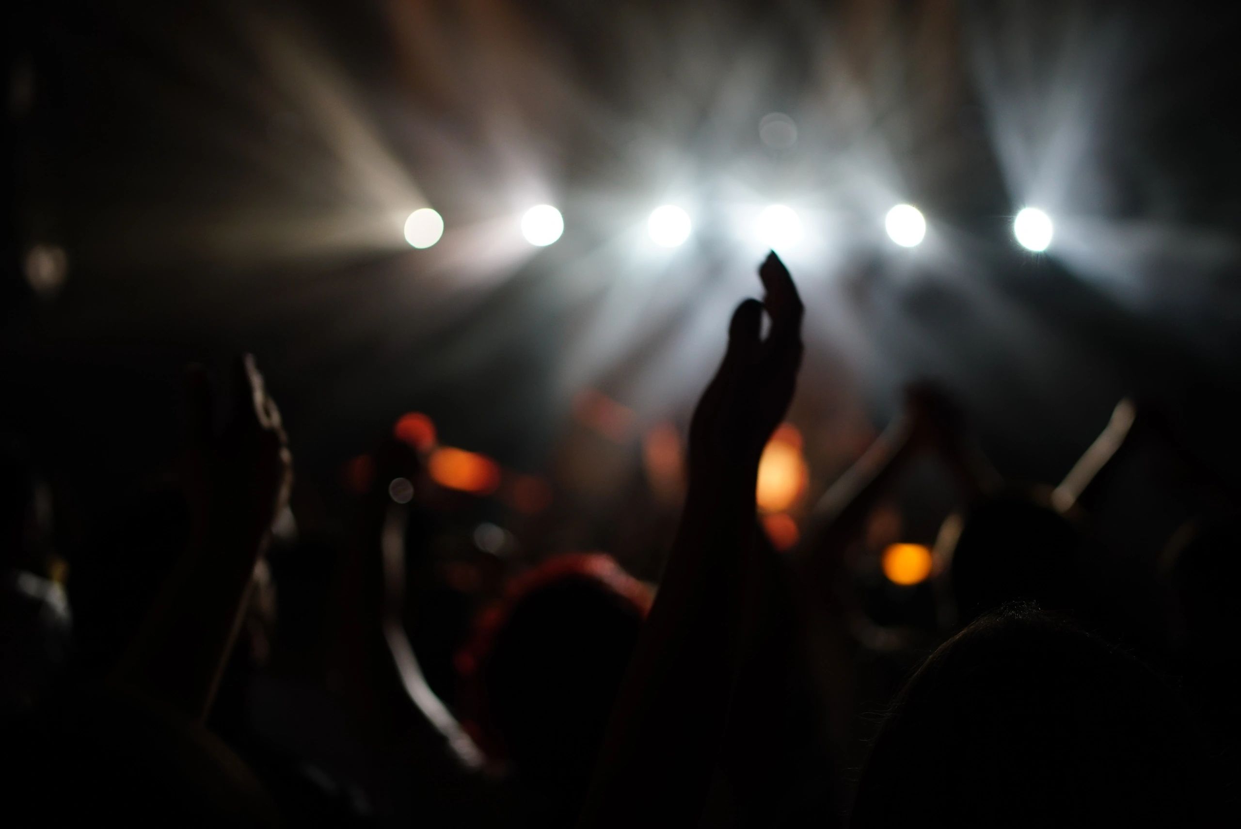 Worship gathering with raised hands